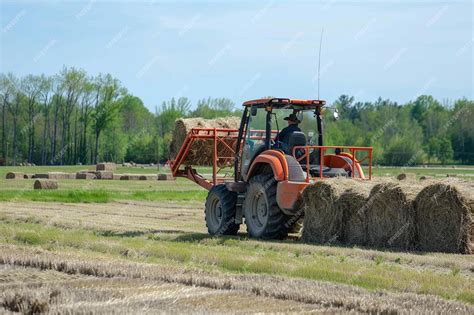 feeding hay with skid steer|Using Skidsteer to Load Road Bales in Feeder .